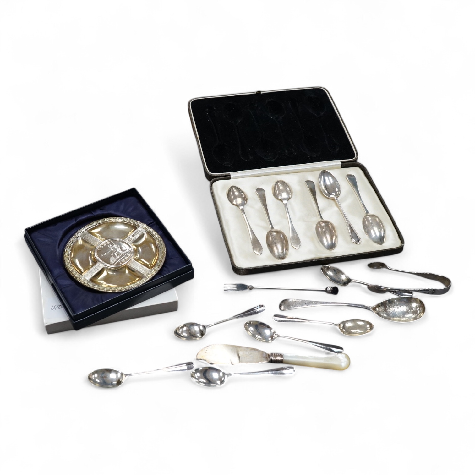A collection silver to include a modern commemorative Britannia standard dish, cased, a cased set of six George VI teaspoons and other sundry flatware.